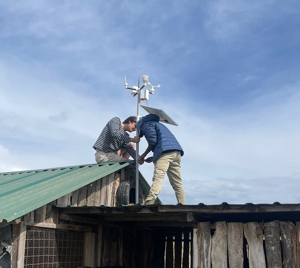 NuaSense team installing a weather station on a farm in Kenya